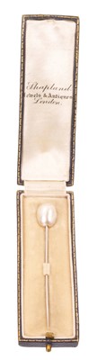 Lot 578 - Edwardian pearl stick pin with a baroque pearl (not tested for natural origin) with white metal pin in fitted leather box retailed by Shapland.