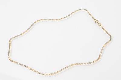 Lot 599 - Edwardian gold and platinum chain with sections of alternating gold and platinum curb links, 43cm.