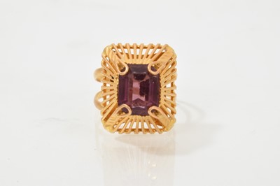 Lot 716 - Eastern yellow metal and purple stone dress ring