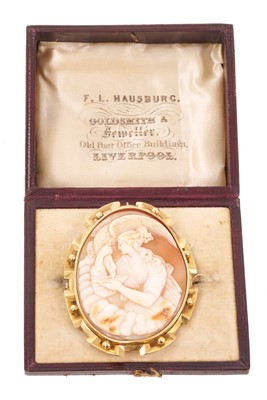 Lot 588 - Mid 19th century Italian carved shell cameo depicting the Greek goddess Hebe feeding the eagle of Zeus, signature to the reverse, in a yellow metal brooch mount, 60mm, in original fitted leather...