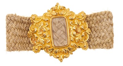 Lot 589 - Regency gold and hair work bracelet, the gold clasp engraved 'Ann Hammond, Obit 3 January 1830', on a finely platted hair band.