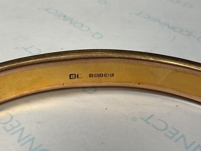 Lot 31 - 9ct gold bangle with engine turned decoration