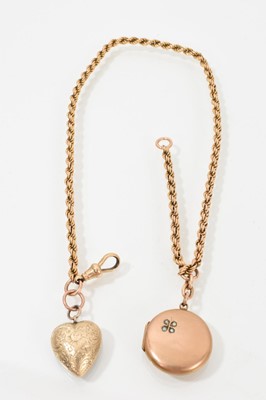 Lot 601 - Victorian gold rope twist chain with a Victorian yellow metal heart shaped locket containing a lock of platted hair, and an Edwardian yellow metal circular locket with seed pearl four-leaf clove...
