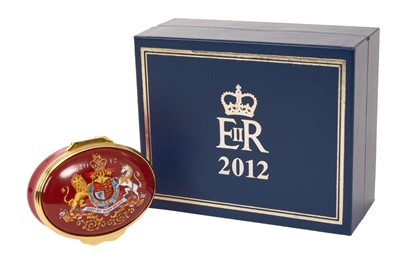Lot 132 - H.M. Queen Elizabeth II, Royal Household Christmas gift 2012, Halcyon Days oval enamel box decorated with the Royal Arms and inscribed' Presented by Her Majesty The Queen Christmas 2012', in fitt...