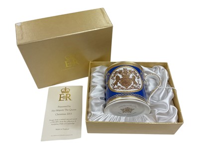 Lot 133 - H.M. Queen Elizabeth II, Royal Household Christmas gift 2013, Royal porcelain mug decorated with the Royal Arms and ' Presented by Her Majesty The Queen' in fitted box with crowned ERII cypher to...
