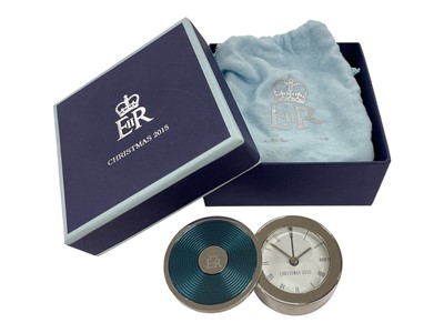 Lot 134 - H.M. Queen Elizabeth II, Royal Household Christmas gift 2015, silver plated and enamel quartz alarm clock, the swiveling cover with crowned ERII cypher and the dial marked ' Christmas 2015' ', in...