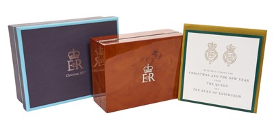 Lot 135 - H.M. Queen Elizabeth II, Royal Household Christmas gift 2017, burr maple jewel box decorated with the Royal Arms with felt roll in fitted box with crowned ERII cypher to lid and card
