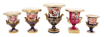 Lot 303 - Five 19th century Coalport porcelain urns, each painted with flowers, one of them on a maroon ground and the others on a cobalt blue ground, 12cm to 19cm high