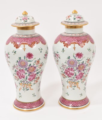 Lot 304 - Pair of Samson porcelain baluster vases and covers, painted with flowers in the Chinese famille rose style, marks to bases, 29cm high