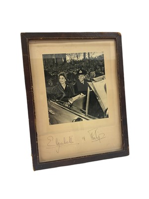 Lot 155 - T.R.H. The Princess Elizabeth (later H.M. Queen Elizabeth II) and The Duke of Edinburgh, signed 1951 Tour of Canada photograph signed in ink on mount ' Elizabeth Philip' in glazed leather frame w...