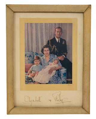 Lot 156 - T.R.H. The Princess Elizabeth (later H.M. Queen Elizabeth II) and The Duke of Edinburgh, signed 1951portrait photograph of the happy couple with young Prince Charles and infant Princess Anne sign...