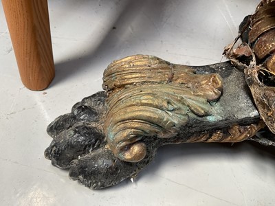 Lot 5377 - Pair of Italianate painted and gilt heavy cast metal pedestals, with figural supports and paw feet, 75cm high