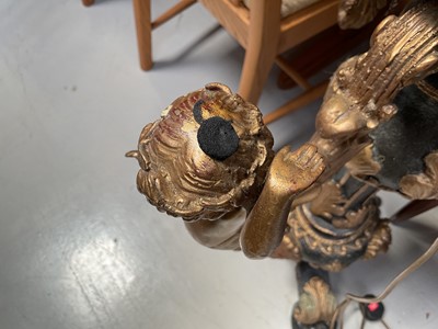 Lot 5377 - Pair of Italianate painted and gilt heavy cast metal pedestals, with figural supports and paw feet, 75cm high