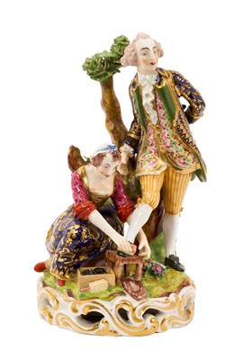 Lot 326 - Derby group of the 'shoe black', c.1820, the figures on a grassy mound on top of a round gilt scrollwork base, inscribed mark and incised model number to base, 17.5cm high