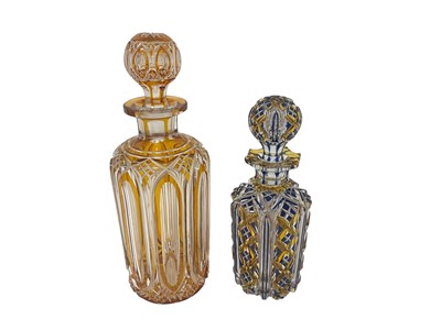 Lot 328 - Two good quality Bohemian flash cut glass decanters, the larger in orange, the other blue and orange, 21cm and 26.5cm high (2)50
