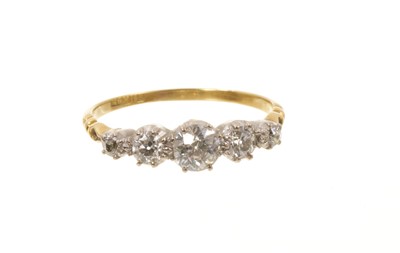 Lot 659 - Edwardian diamond five stone ring with five graduated old cut diamonds in collet setting, pierced shoulders on tapered gold shank, estimated total diamond weight approximately 0.70cts, ring size...
