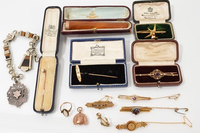 Lot 658 - Collection of Victorian and Edwardian gold brooches, stick pins, and a Victorian tiger's eye and white metal fob chain