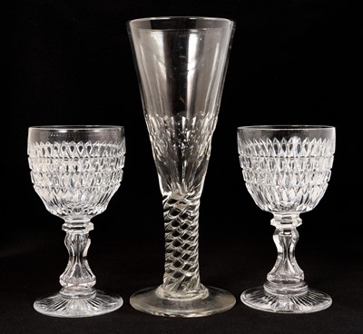 Lot 336 - Pair of good quality Victorian cut glass wine goblets, with annulated hourglass stems and star cut bases, 19cm high, together with an oversized flute glass with facet cut bowl and moulded twist...