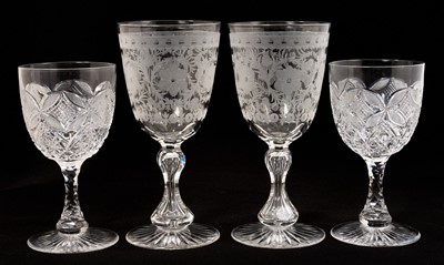 Lot 305 - Pair of good quality Victorian cut glass wine goblets engraved with a foliate pattern, with hourglass stems and star cut bases, 19.75cm high, together with another pair of Victorian cut glass wi...