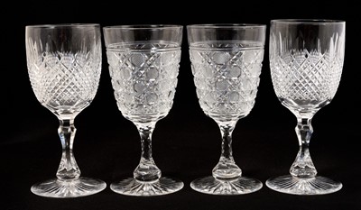 Lot 306 - Pair of Victorian cut glass wine goblets with checkerboard pattern to the bowls and star cut bases, 17.5cm high, together with another pair of Victorian cut glass wine goblets with facet cut thu...