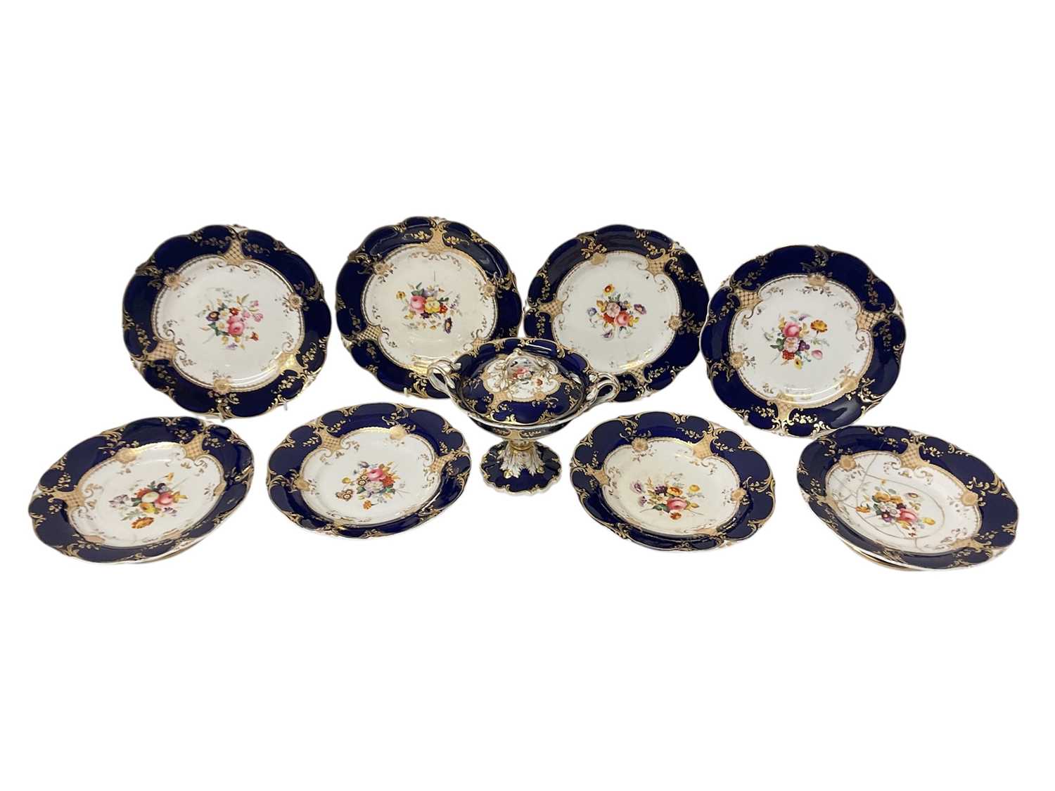 Lot 5059 - 19th century Staffordshire dessert service, painted with flowers on a cobalt blue and gilt ground, consisting of four plates, four comports, and a tureen and cover