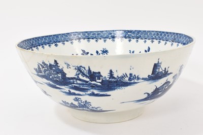 Lot 5038 - Lowestoft blue and white punch bowl, circa 1775, printed to the exterior with figures in a Chinese island landscape, with further similar landscape vignettes, the interior with floral sprays and...