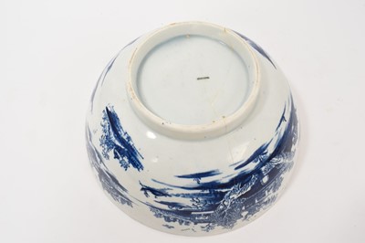 Lot 5038 - Lowestoft blue and white punch bowl, circa 1775, printed to the exterior with figures in a Chinese island landscape, with further similar landscape vignettes, the interior with floral sprays and...