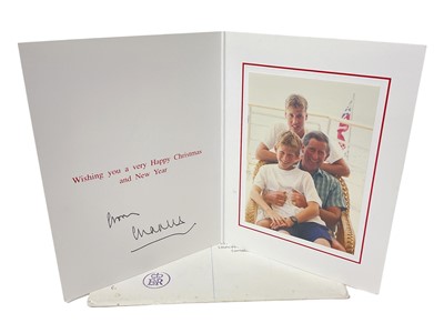 Lot 186 - H.R.H. Prince Charles, Prince of Wales (now H.M. King Charles III) signed 1987 Christmas card with gilt cipher to cover and colour photograph of the Prince with his two young sons, with envelope<...