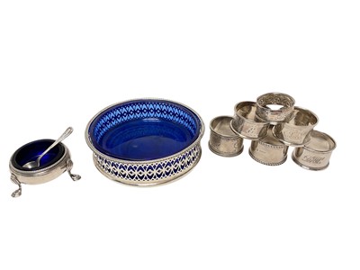 Lot 455 - George III silver salt cellar of cauldron form, (London 1771), together with five various silver napkin rings, a silver salt spoon and a silver plated bottle coaster, (various dates and makers),...