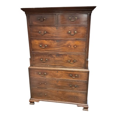 Lot 1485 - George III mahogany chest on chest, the upper part with dentil cornice and two short over three graduated drawers between quarter fluted columns, the base with three graduated drawers on ogee br...