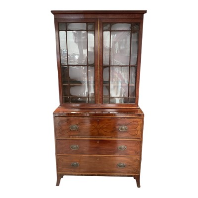 Lot 1490 - Regency mahogany secretaire bookcase, having astragal glazed top, with ebony line inlaid base with well fitted fall-front secretaire drawer and two drawers below on splayed bracket feet, 110cm...