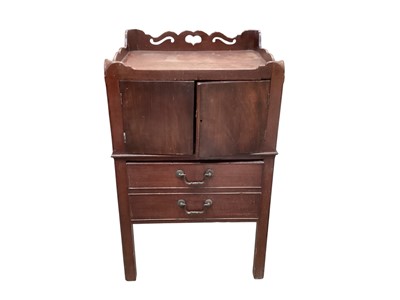 Lot 1496 - George III mahogany bedside table, with gallery top above pair of cupboard doors and two drawers below on square supports, 51cm wide x 45cm deep x 83cm high