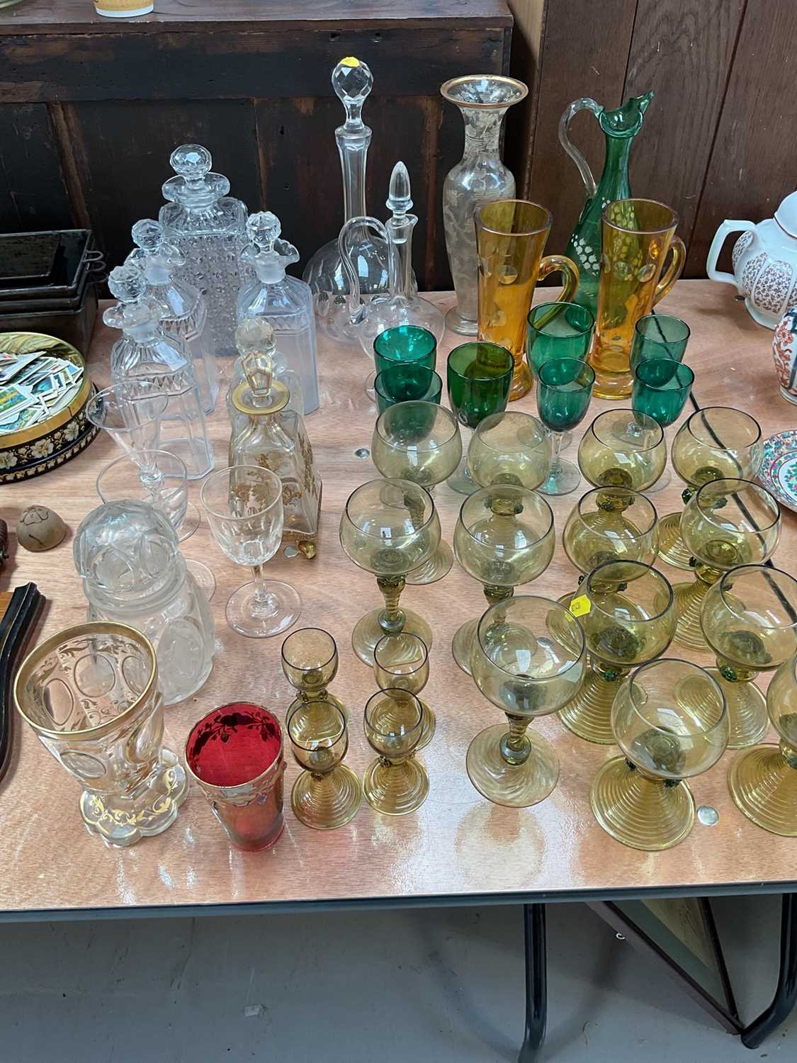 Lot 5094 - Group of antique and later glassware, including a Bohemian cut glass goblet engraved with cameos of German landmarks, collection of roemer glasses, decanters, etc