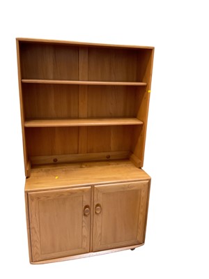 Lot 5325 - Ercol two height bookcase with adjustable shelves above and cupboards below, 91cm wide, 43.5cm deep, 162cm high