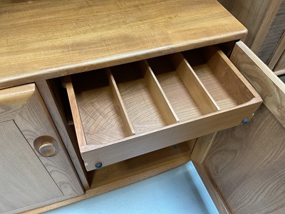 Lot 5325 - Ercol two height bookcase with adjustable shelves above and cupboards below, 91cm wide, 43.5cm deep, 162cm high