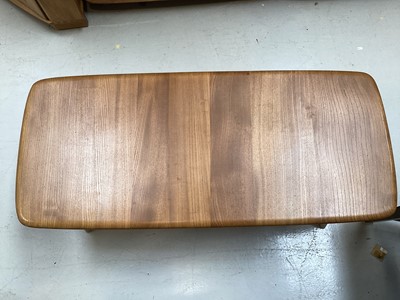 Lot 5344 - Ercol coffee table with magazine rack undertier, 103cm x 46cm x 36cm high