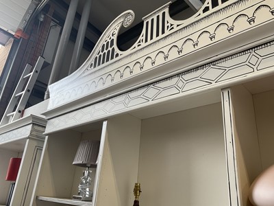 Lot 5369 - Highly decorative handmade and painted two height bookcase, with arched pediments and cupboards below, 180cm wide x 54cm deep x 295cm high