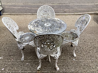 Lot 5349 - Painted cast alloy garden table and four chairs