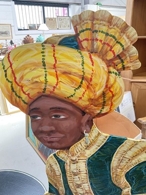 Lot 5163 - Stylish hand painted modern dummy board, in the form of a turbaned gentleman proffering a tray, painted to both faces