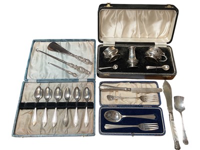 Lot 58 - Late 1950s silver three piece cruet set in fitted case, silver spoon and fork set in case, Victorian silver knife and fork set, set of six sterling teaspoons