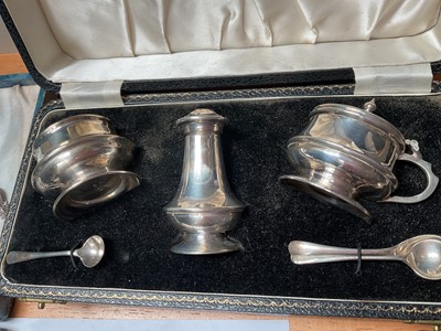Lot 58 - Late 1950s silver three piece cruet set in fitted case, silver spoon and fork set in case, Victorian silver knife and fork set, set of six sterling teaspoons