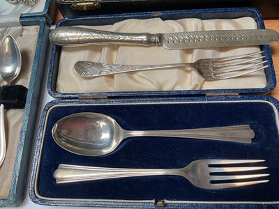 Lot 58 - Late 1950s silver three piece cruet set in fitted case, silver spoon and fork set in case, Victorian silver knife and fork set, set of six sterling teaspoons