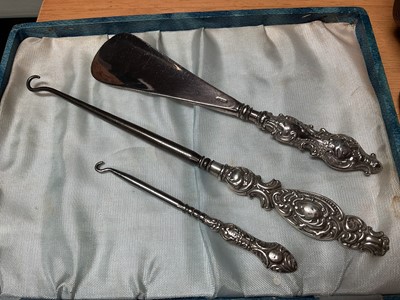 Lot 58 - Late 1950s silver three piece cruet set in fitted case, silver spoon and fork set in case, Victorian silver knife and fork set, set of six sterling teaspoons
