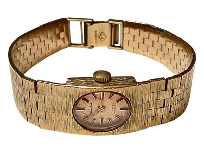 Lot 2 - Vintage Chevalier 9ct gold ladies wristwatch with an integral 9ct gold bark effect articulated bracelet (London 1970)
