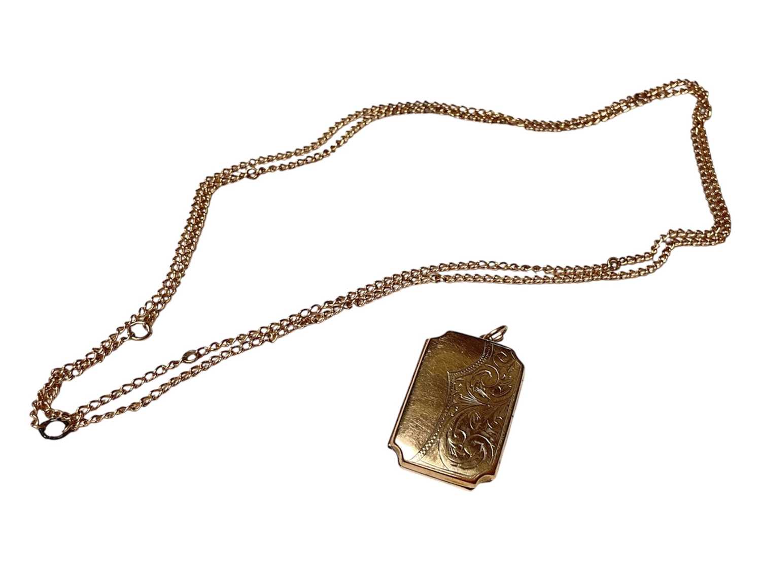 Lot 4 - 9ct gold back and front rectangular locket and a yellow metal chain (2)