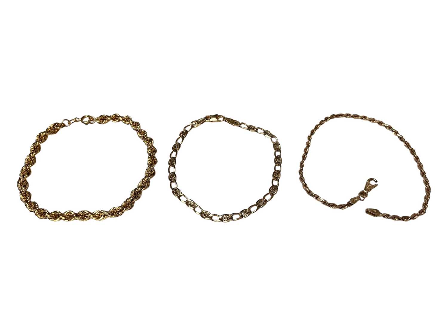 Lot 8 - 9ct gold rope twist chain bracelet, 19.5cm, one other 9ct gold bracelet, 18cm, and a 14ct gold bracelet with a 9ct gold broken clasp, 20.5cm (3)