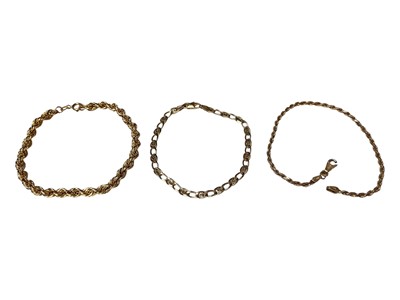 Lot 8 - 9ct gold rope twist chain bracelet, 19.5cm, one other 9ct gold bracelet, 18cm, and a 14ct gold bracelet with a 9ct gold broken clasp, 20.5cm (3)