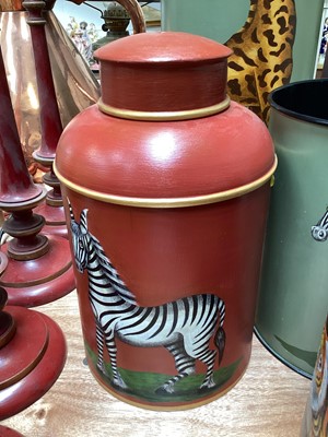 Lot 5154 - Two tôleware hand painted table lamps in the form of tea canisters, a similar waste paper bin and umbrella stand (4)