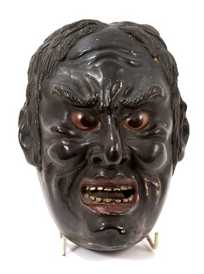 Lot 830 - Japanese lacquered mask, together with a Japanese seated figure