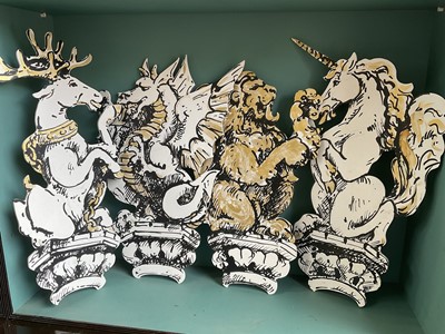 Lot 5169 - Set of four stylish hand painted dummy boards, in the form of busts of heraldic beasts